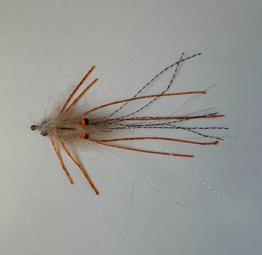 Close-up of the best bonefish fly for fishing in Grand Cayman, Cayman Islands
